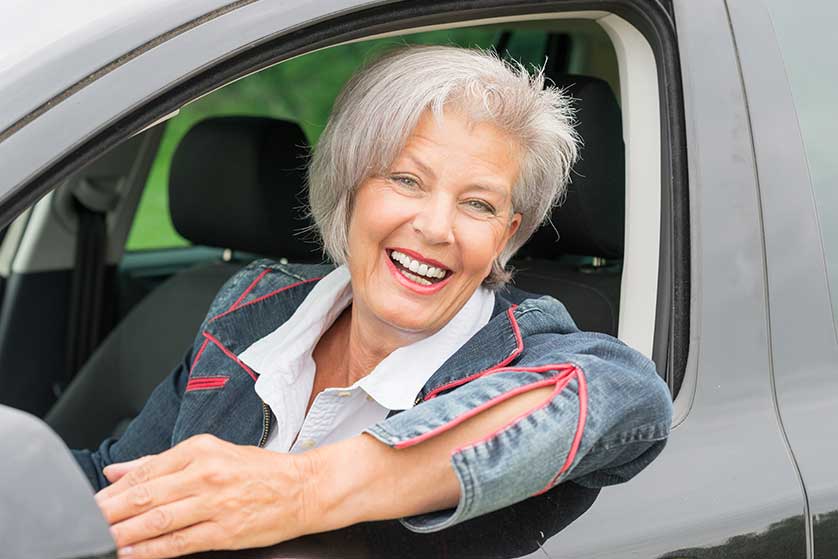 Older woman driving a car